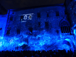 The southern wall at the Cour d`Honneur courtyard of the Palais des Papes palace, during the Les Luminessences d`Avignon light show, by night