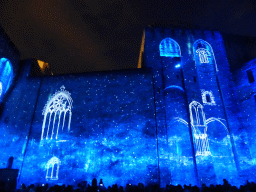 The eastern wall at the Cour d`Honneur courtyard of the Palais des Papes palace, during the Les Luminessences d`Avignon light show, by night