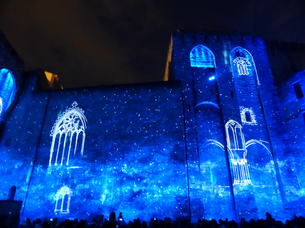 The eastern wall at the Cour d`Honneur courtyard of the Palais des Papes palace, during the Les Luminessences d`Avignon light show, by night