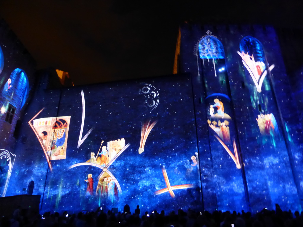 The eastern wall at the Cour d`Honneur courtyard of the Palais des Papes palace, during the Les Luminessences d`Avignon light show, by night