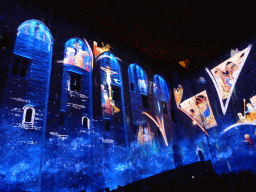 The northeastern wall at the Cour d`Honneur courtyard of the Palais des Papes palace, during the Les Luminessences d`Avignon light show, by night