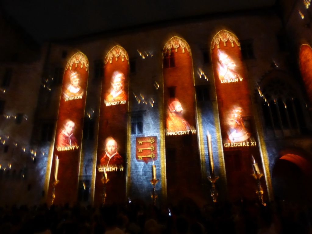 The southern wall at the Cour d`Honneur courtyard of the Palais des Papes palace, during the Les Luminessences d`Avignon light show, by night