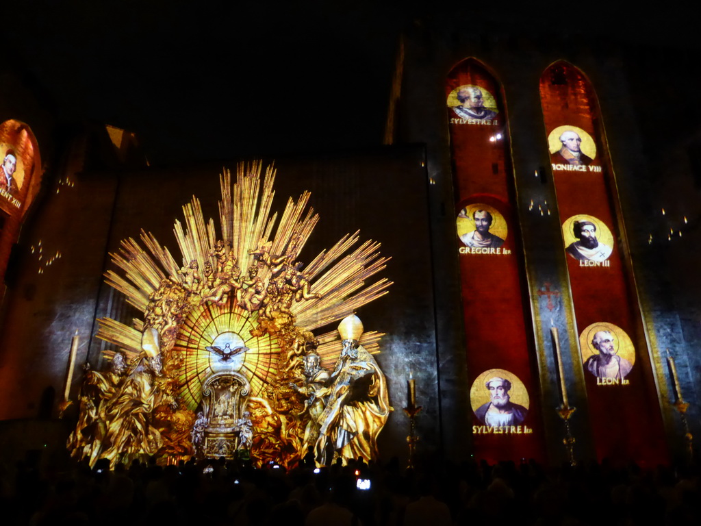 The eastern wall at the Cour d`Honneur courtyard of the Palais des Papes palace, during the Les Luminessences d`Avignon light show, by night