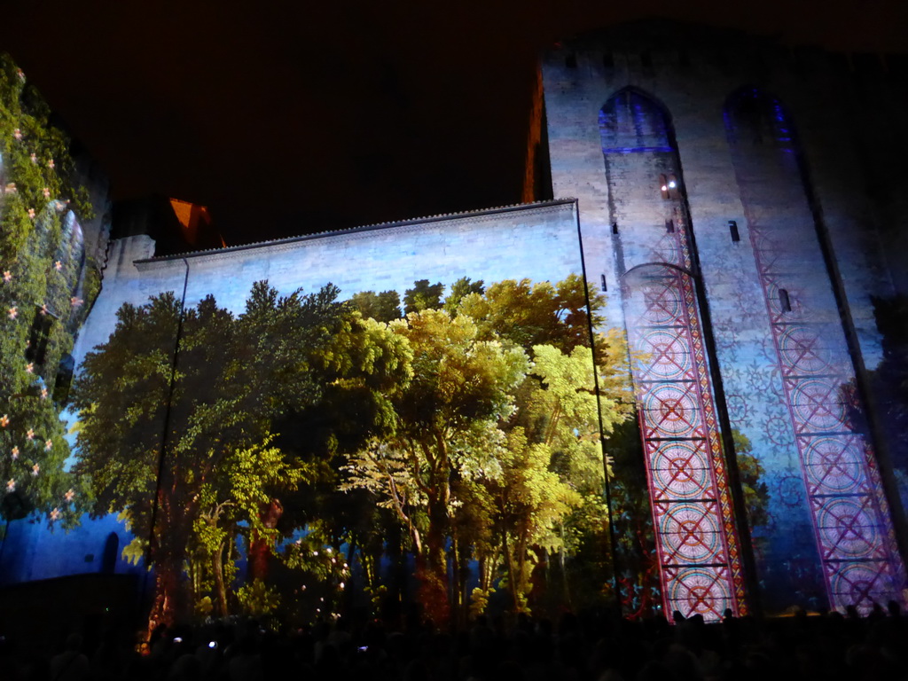 The eastern wall at the Cour d`Honneur courtyard of the Palais des Papes palace, during the Les Luminessences d`Avignon light show, by night