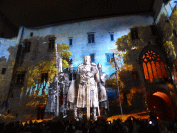 The southern wall at the Cour d`Honneur courtyard of the Palais des Papes palace, during the Les Luminessences d`Avignon light show, by night