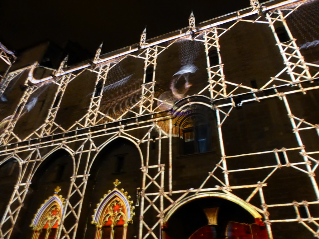 The western wall at the Cour d`Honneur courtyard of the Palais des Papes palace, during the Les Luminessences d`Avignon light show, by night