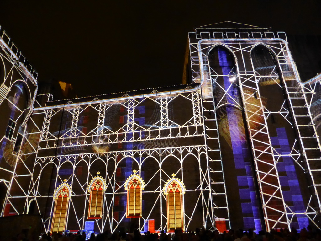 The eastern wall at the Cour d`Honneur courtyard of the Palais des Papes palace, during the Les Luminessences d`Avignon light show, by night