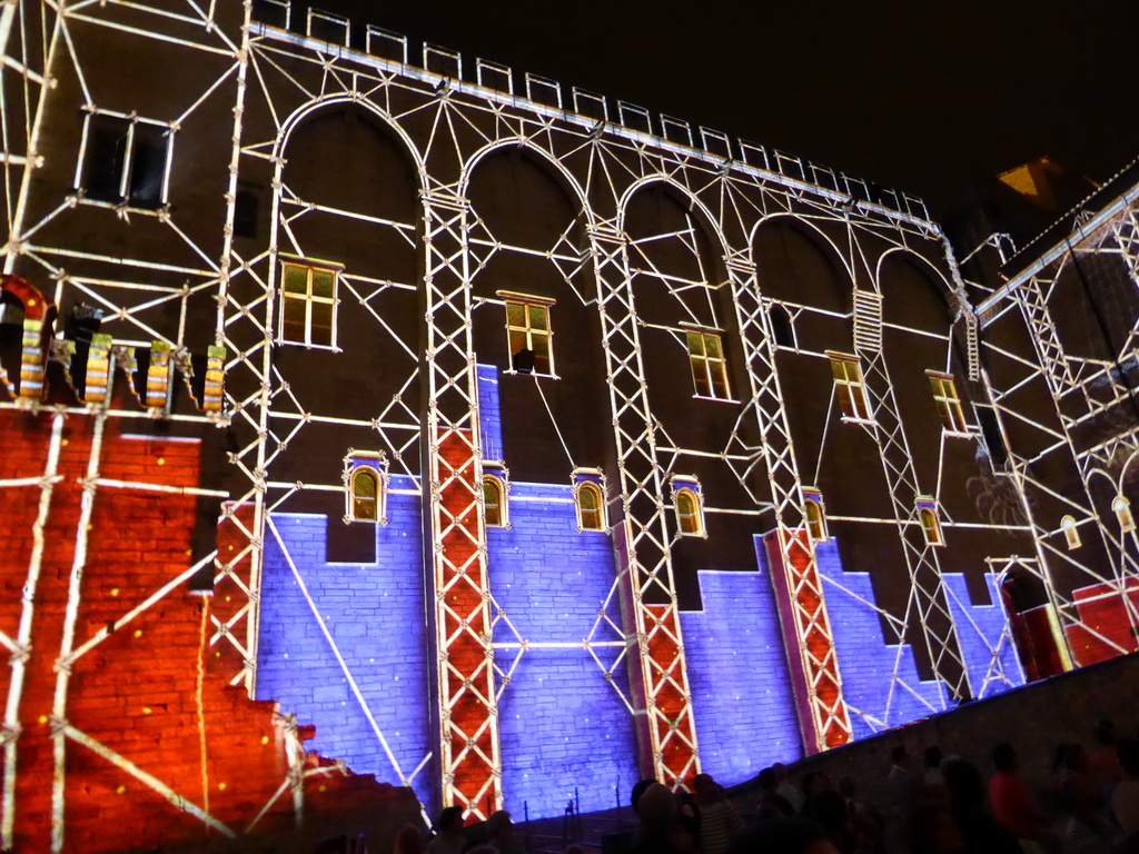 The northern wall at the Cour d`Honneur courtyard of the Palais des Papes palace, during the Les Luminessences d`Avignon light show, by night