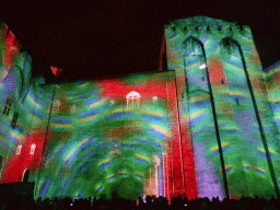 The eastern wall at the Cour d`Honneur courtyard of the Palais des Papes palace, during the Les Luminessences d`Avignon light show, by night