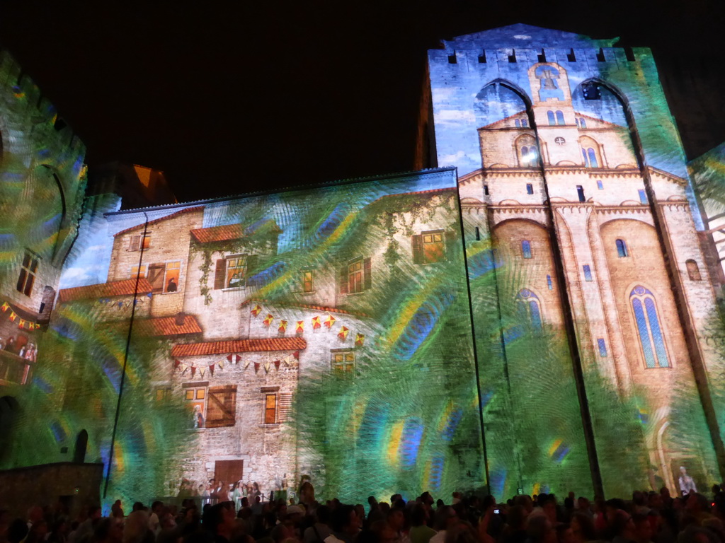 The eastern wall at the Cour d`Honneur courtyard of the Palais des Papes palace, during the Les Luminessences d`Avignon light show, by night