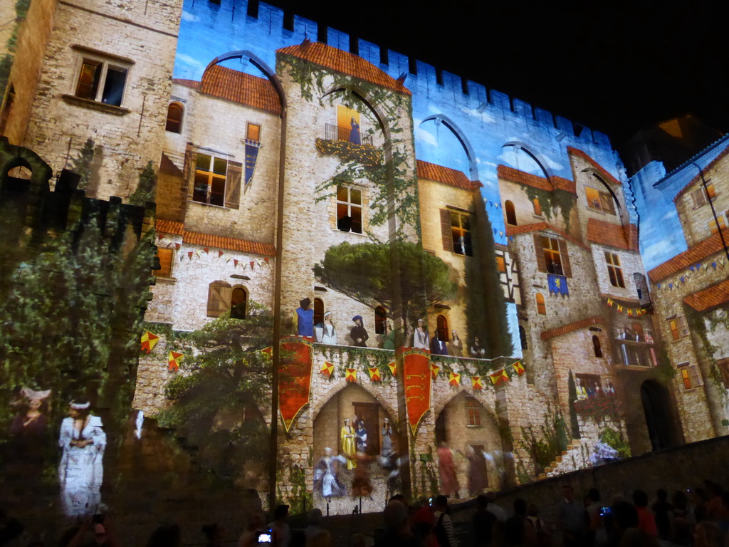 The northern wall at the Cour d`Honneur courtyard of the Palais des Papes palace, during the Les Luminessences d`Avignon light show, by night