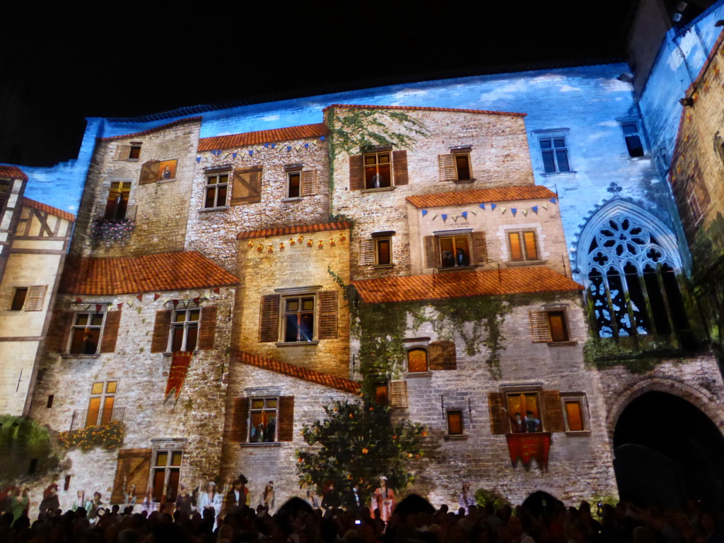 The southern wall at the Cour d`Honneur courtyard of the Palais des Papes palace, during the Les Luminessences d`Avignon light show, by night