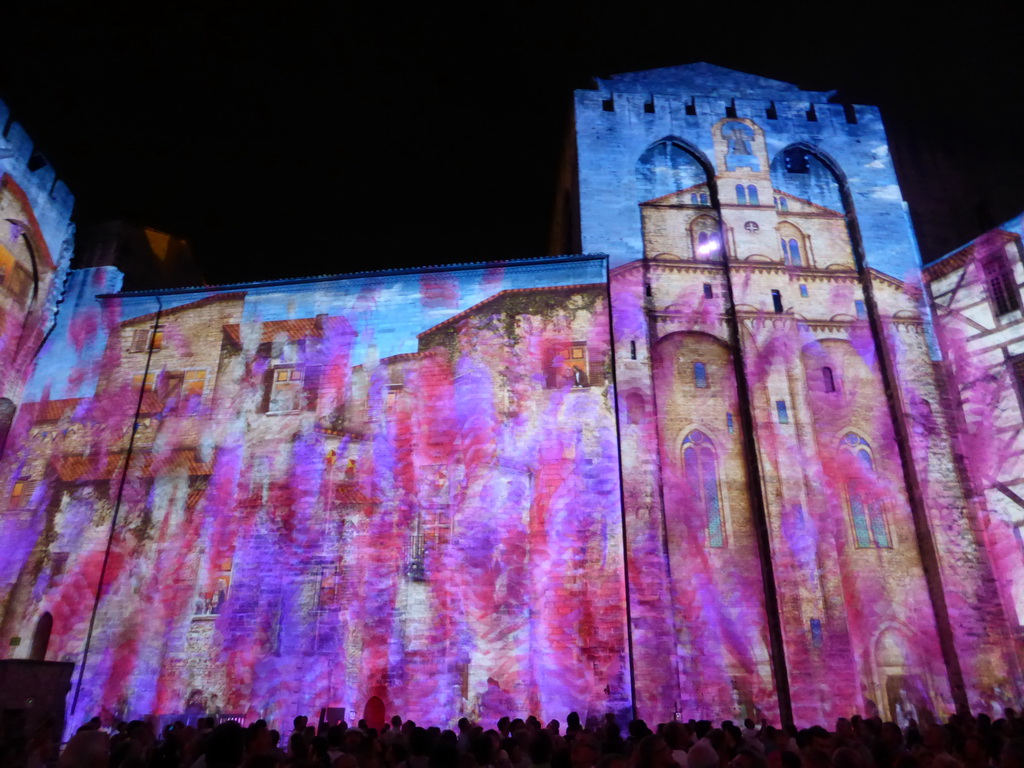 The eastern wall at the Cour d`Honneur courtyard of the Palais des Papes palace, during the Les Luminessences d`Avignon light show, by night