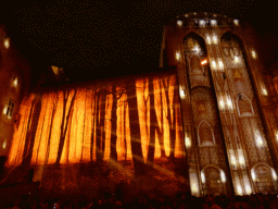 The eastern wall at the Cour d`Honneur courtyard of the Palais des Papes palace, during the Les Luminessences d`Avignon light show, by night