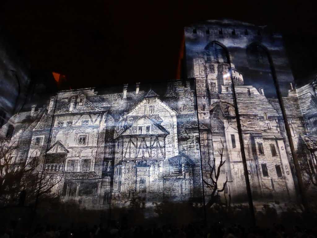 The eastern wall at the Cour d`Honneur courtyard of the Palais des Papes palace, during the Les Luminessences d`Avignon light show, by night