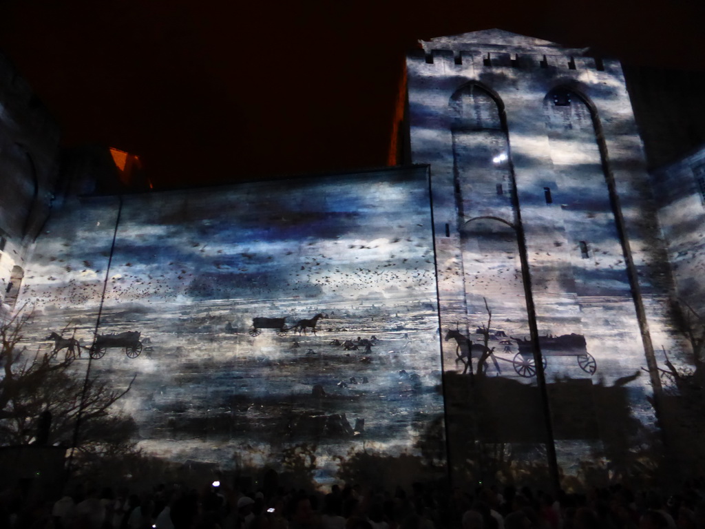 The eastern wall at the Cour d`Honneur courtyard of the Palais des Papes palace, during the Les Luminessences d`Avignon light show, by night