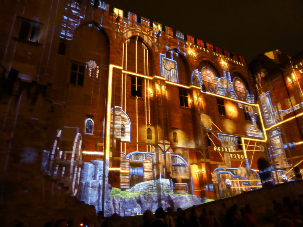 The northern wall at the Cour d`Honneur courtyard of the Palais des Papes palace, during the Les Luminessences d`Avignon light show, by night