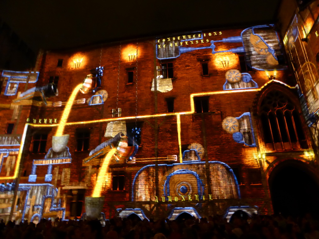 The southern wall at the Cour d`Honneur courtyard of the Palais des Papes palace, during the Les Luminessences d`Avignon light show, by night