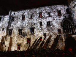 The southern wall at the Cour d`Honneur courtyard of the Palais des Papes palace, during the Les Luminessences d`Avignon light show, by night