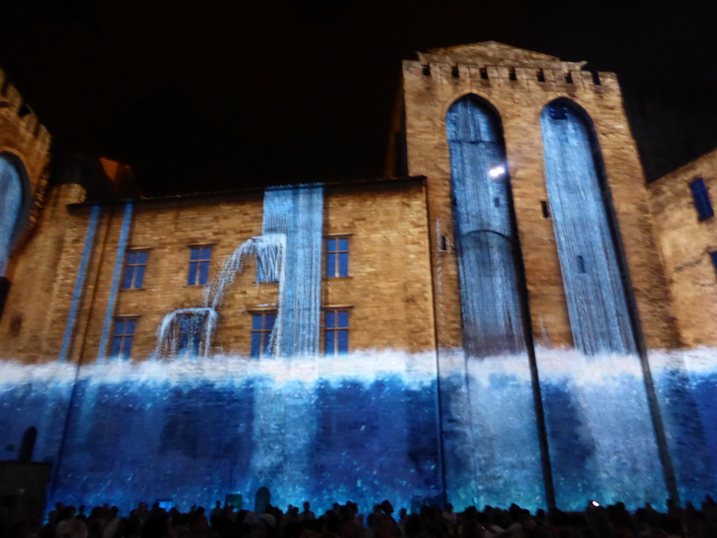 The eastern wall at the Cour d`Honneur courtyard of the Palais des Papes palace, during the Les Luminessences d`Avignon light show, by night