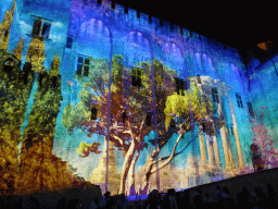 The northern wall at the Cour d`Honneur courtyard of the Palais des Papes palace, during the Les Luminessences d`Avignon light show, by night