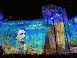 The eastern wall at the Cour d`Honneur courtyard of the Palais des Papes palace, during the Les Luminessences d`Avignon light show, by night