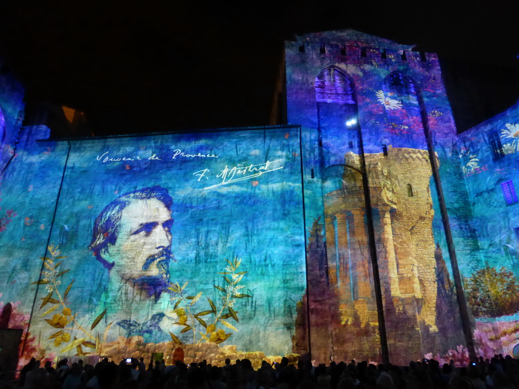 The eastern wall at the Cour d`Honneur courtyard of the Palais des Papes palace, during the Les Luminessences d`Avignon light show, by night