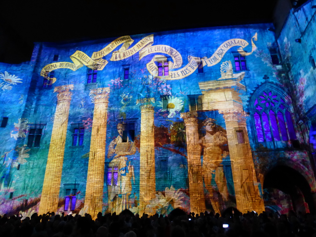 The southern wall at the Cour d`Honneur courtyard of the Palais des Papes palace, during the Les Luminessences d`Avignon light show, by night