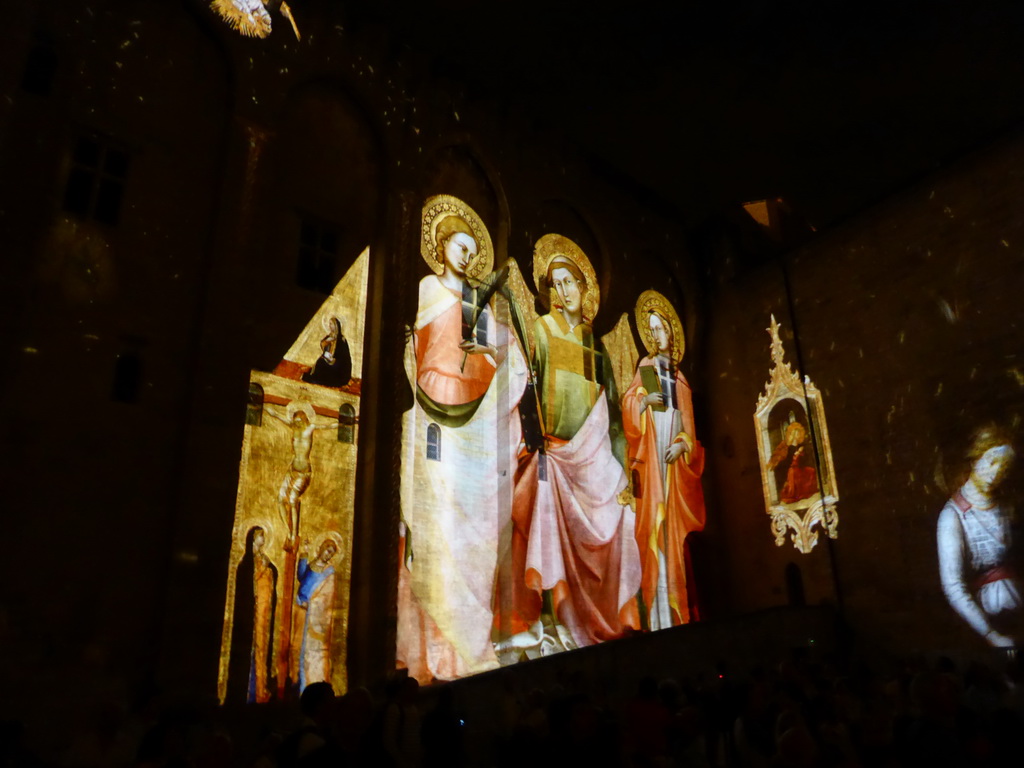 The northern wall at the Cour d`Honneur courtyard of the Palais des Papes palace, during the Les Luminessences d`Avignon light show, by night