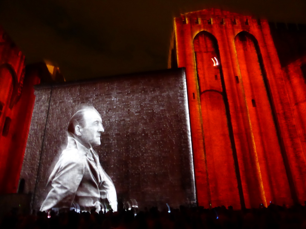 The eastern wall at the Cour d`Honneur courtyard of the Palais des Papes palace, during the Les Luminessences d`Avignon light show, by night