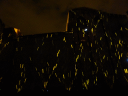 The eastern wall at the Cour d`Honneur courtyard of the Palais des Papes palace, during the Les Luminessences d`Avignon light show, by night