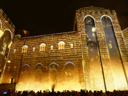 The eastern wall at the Cour d`Honneur courtyard of the Palais des Papes palace, during the Les Luminessences d`Avignon light show, by night