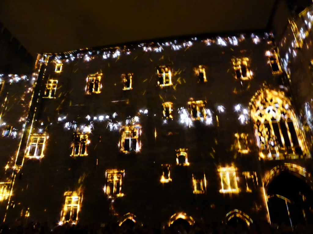 The southern wall at the Cour d`Honneur courtyard of the Palais des Papes palace, during the Les Luminessences d`Avignon light show, by night