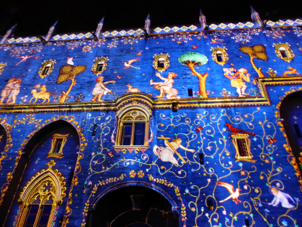 The western wall at the Cour d`Honneur courtyard of the Palais des Papes palace, during the Les Luminessences d`Avignon light show, by night
