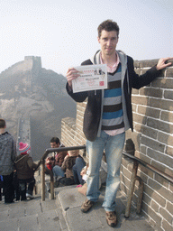 Tim with his certificate just below the Eighth Tower of the North Side of the Badaling Great Wall, with a view on the Seventh Tower