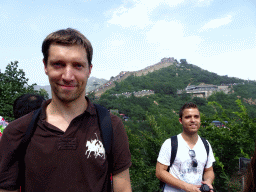 Tim, the Eighth Tower of the North Side of the Badaling Great Wall and the entrance to the cable lift, viewed from a path near the Sixth Tower