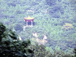 Small pavilion on a hill alongside the G6 Jingzang Expressway, viewed from the tour bus