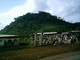 Market and hill along the road from Douala, viewed from the car