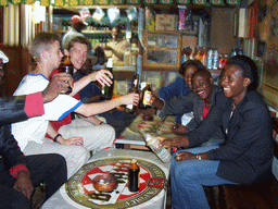 Tim and his friends at a bar along the road from Douala