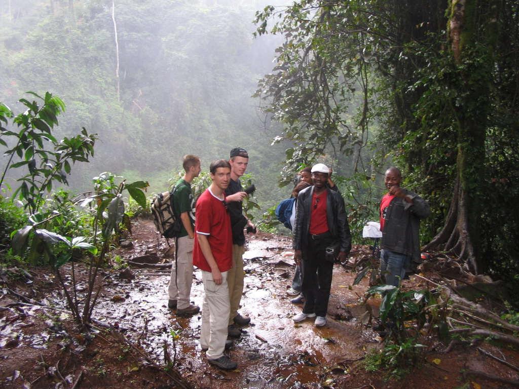 Tim and his friends in front of the Mouankeu Waterfall