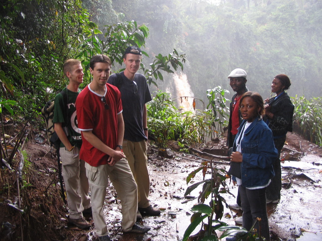 Tim and his friends in front of the Mouankeu Waterfall