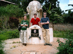 Tim and his friends at a statue in front of the Bandjoun Palace