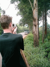 Tim`s friend making a photo at the road from Bafoussam