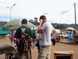 Tim and his friend at a market at the city center