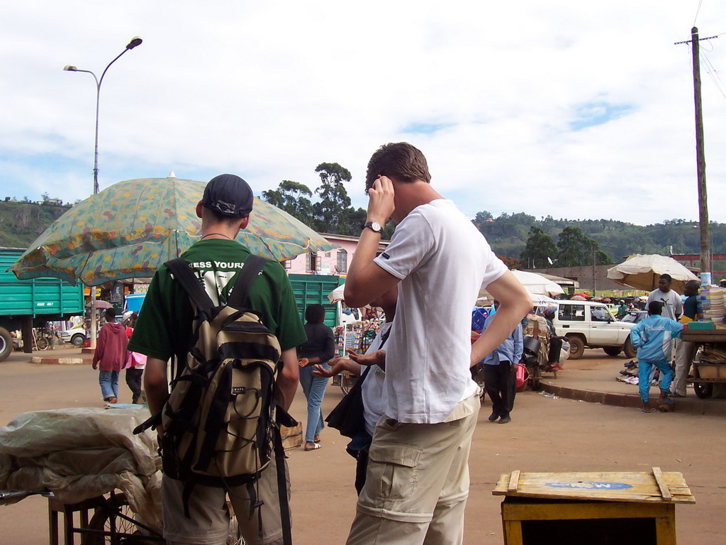 Tim and his friend at a market at the city center