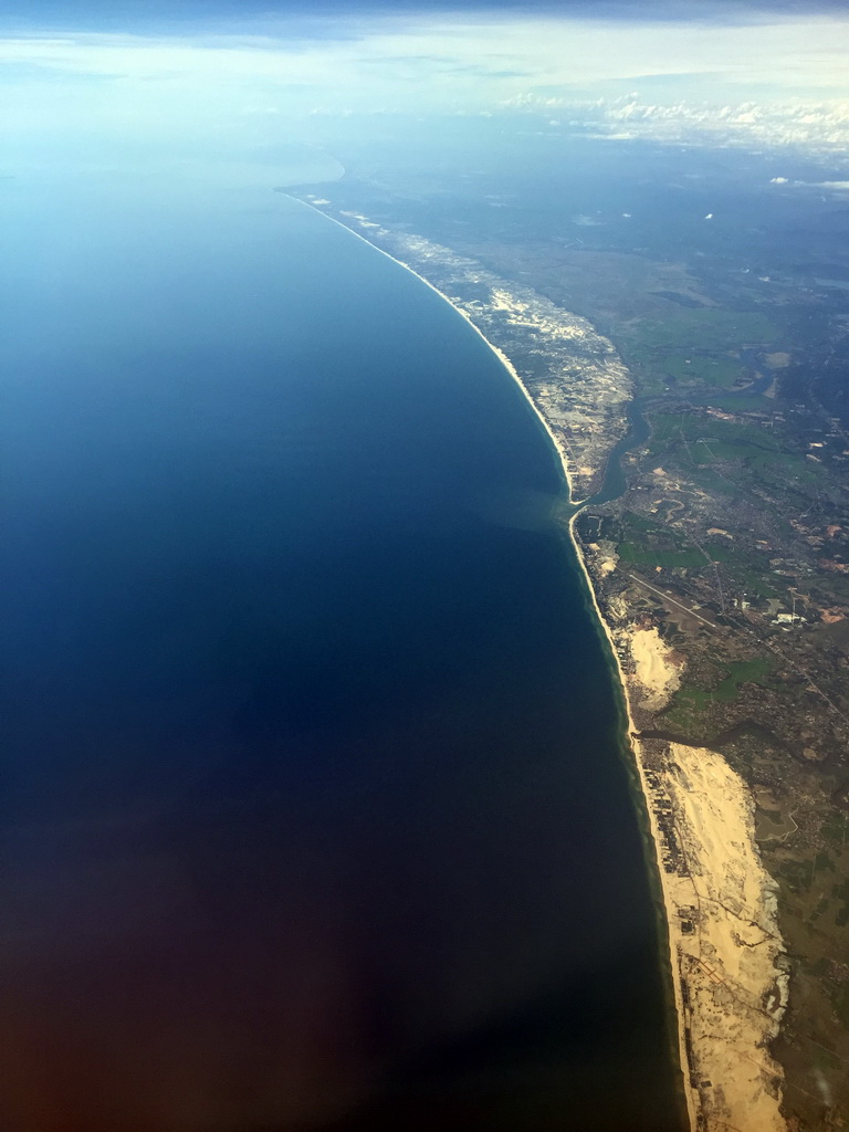 Coastline of the city of Dong Hoi in Vietnam, viewed from the airplane from Haikou