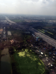 Motorway crossing just north of Bangkok Suvarnabhumi Airport, viewed from the airplane from Haikou