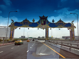 Gateway for King Rama IX`s birthday above the road just north of Bangkok Suvarnabhumi Airport, viewed from the taxi