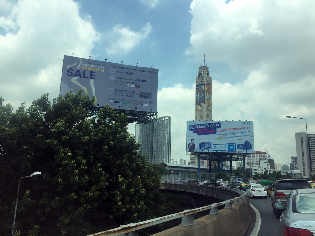 The Baiyoke Tower II and other skyscrapers in the city center, viewed from the taxi on Chaturathid Road