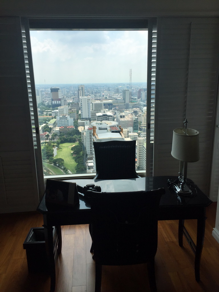 Desk in our living room at the Grande Centre Point Hotel Ratchadamri Bangkok, with a view on the city center